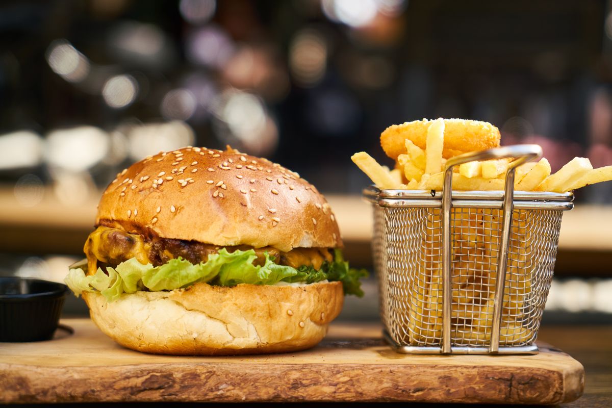 The Hat Trick — triple stack burger with basket fries